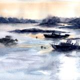 Boats in setting sun